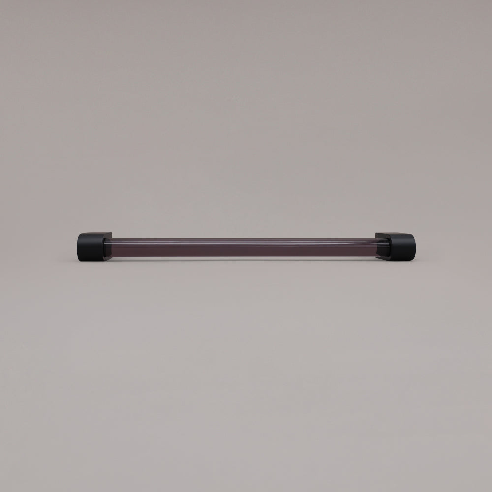 Clarity smoke acrylic and matte black stems 12 inch appliance pull laying on gray background