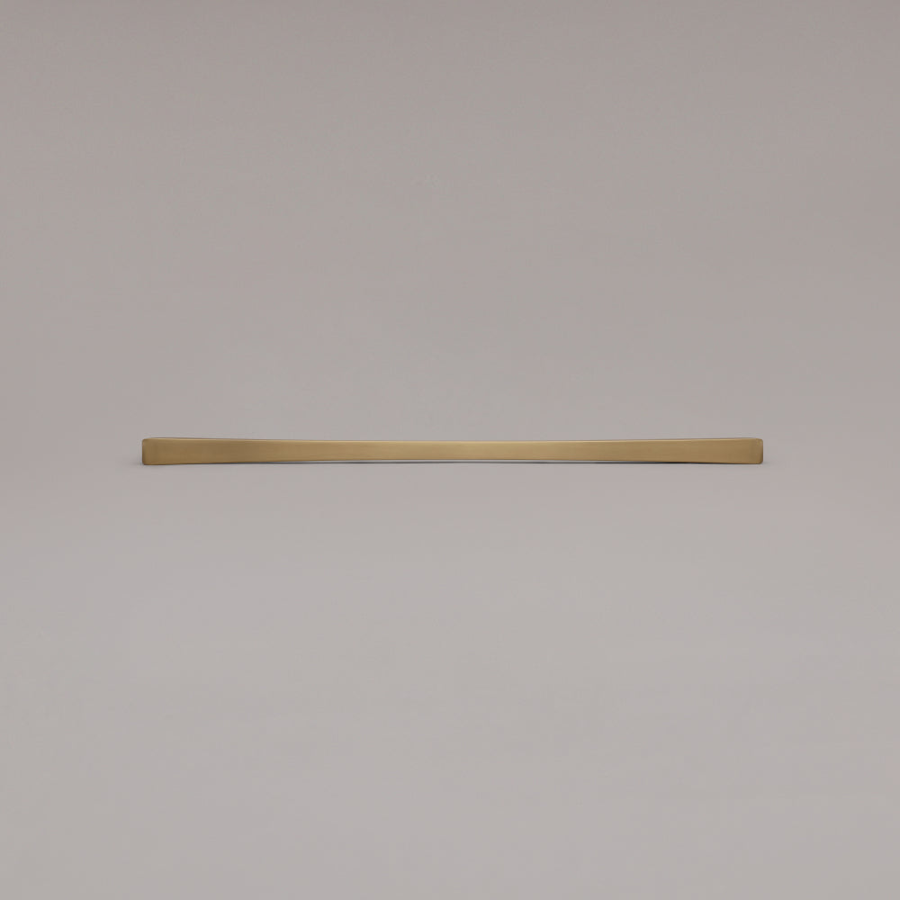 18" Diamond appliance pull in Satin Brass laying on gray background