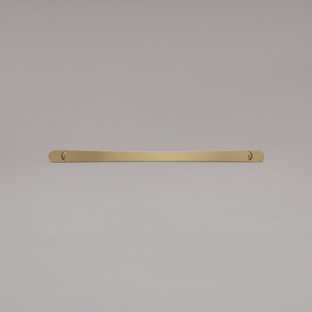 18" Horizon appliance pull in Satin Brass laying on gray background