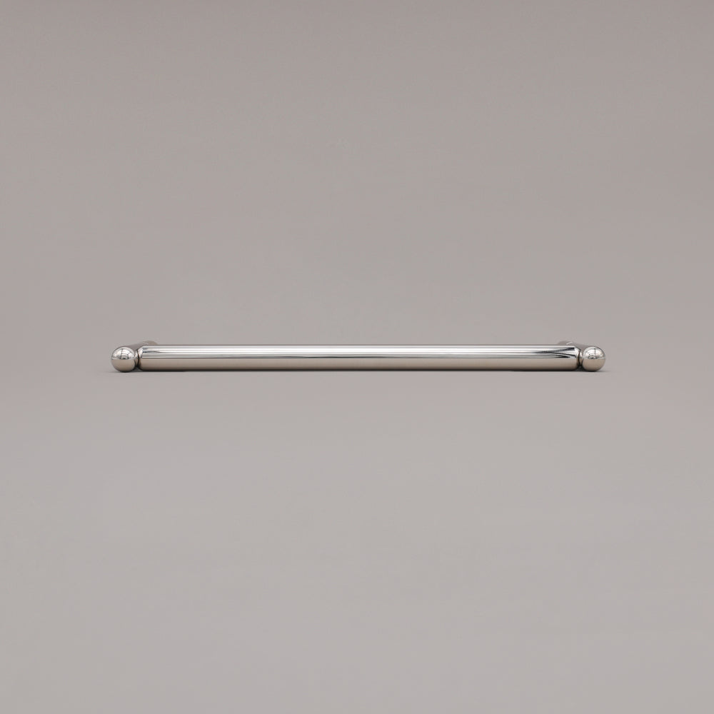 12" Knurled appliance pull in Polished Nickel laying on gray background