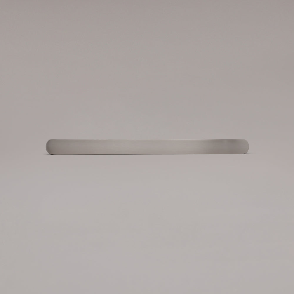 12" Ribbed appliance pull in Satin Nickel laying on gray background