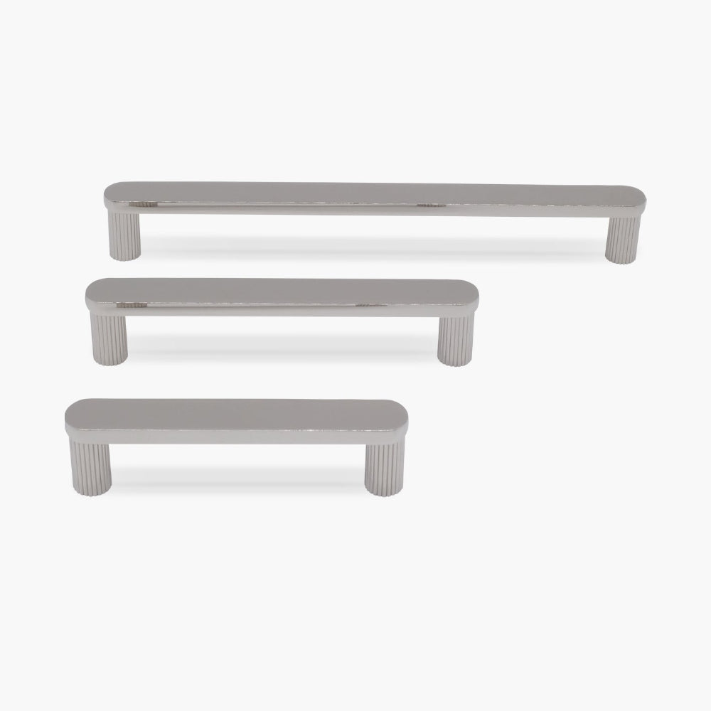 three ribbed polished nickel ribbed pulls in different sizes on white background