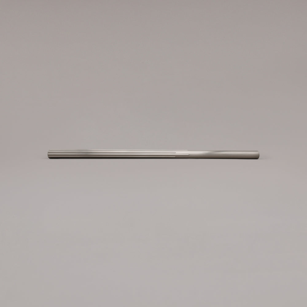 18" Sunburst appliance pull in Satin Nickel laying on gray background