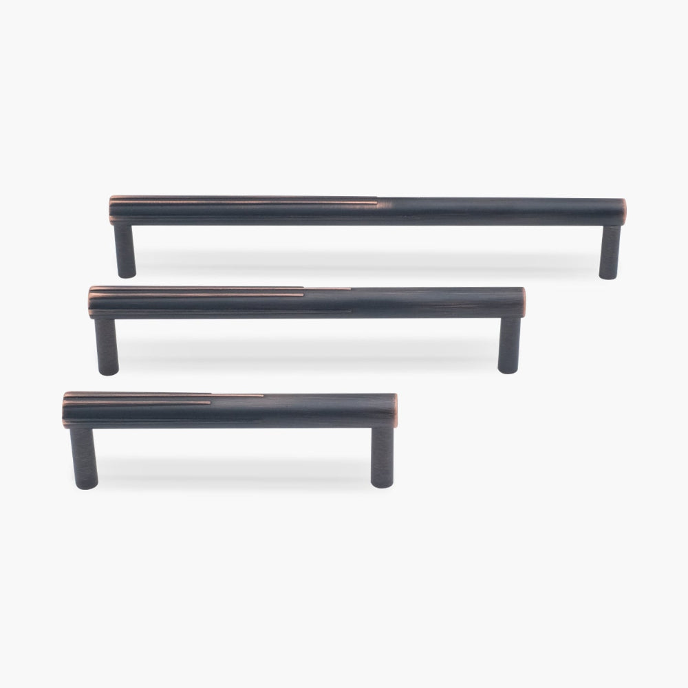 Three venetian bronze sunburst cabinet pulls in three sizes on white background