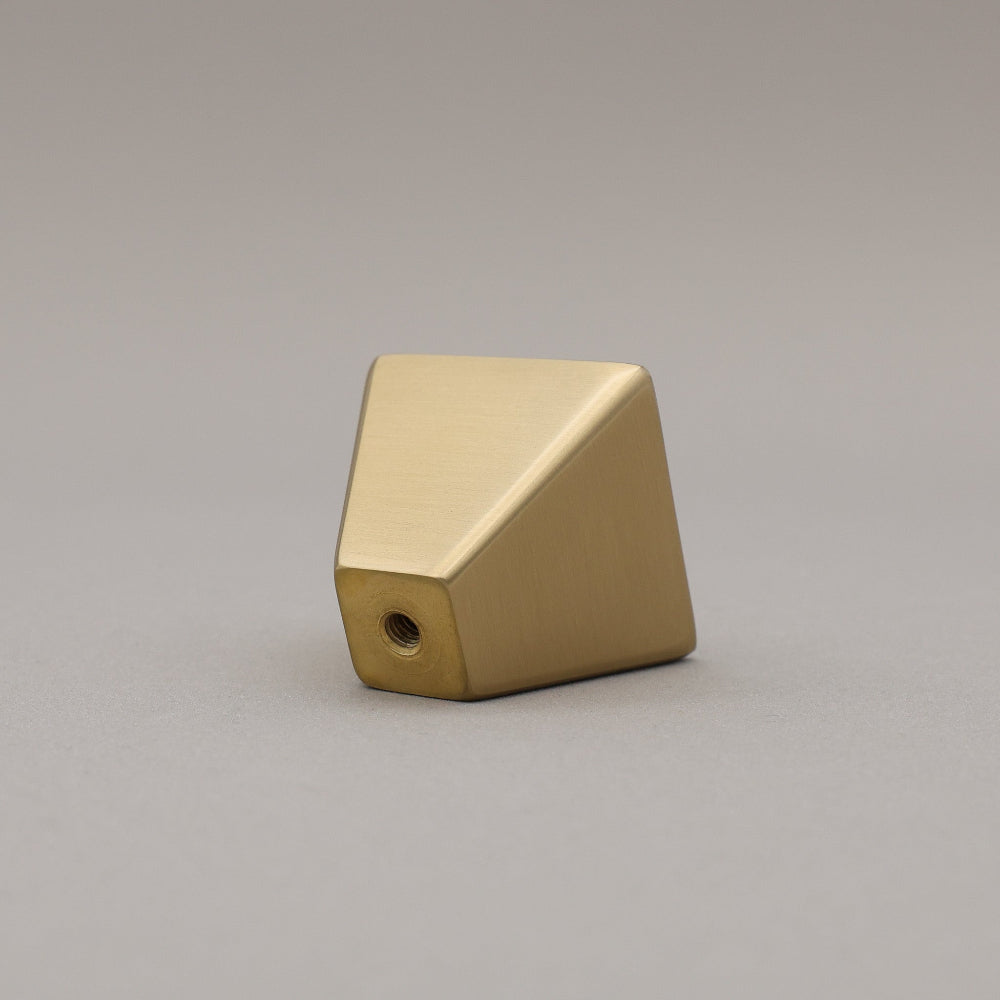 satin brass geometric diamond knob on gray background