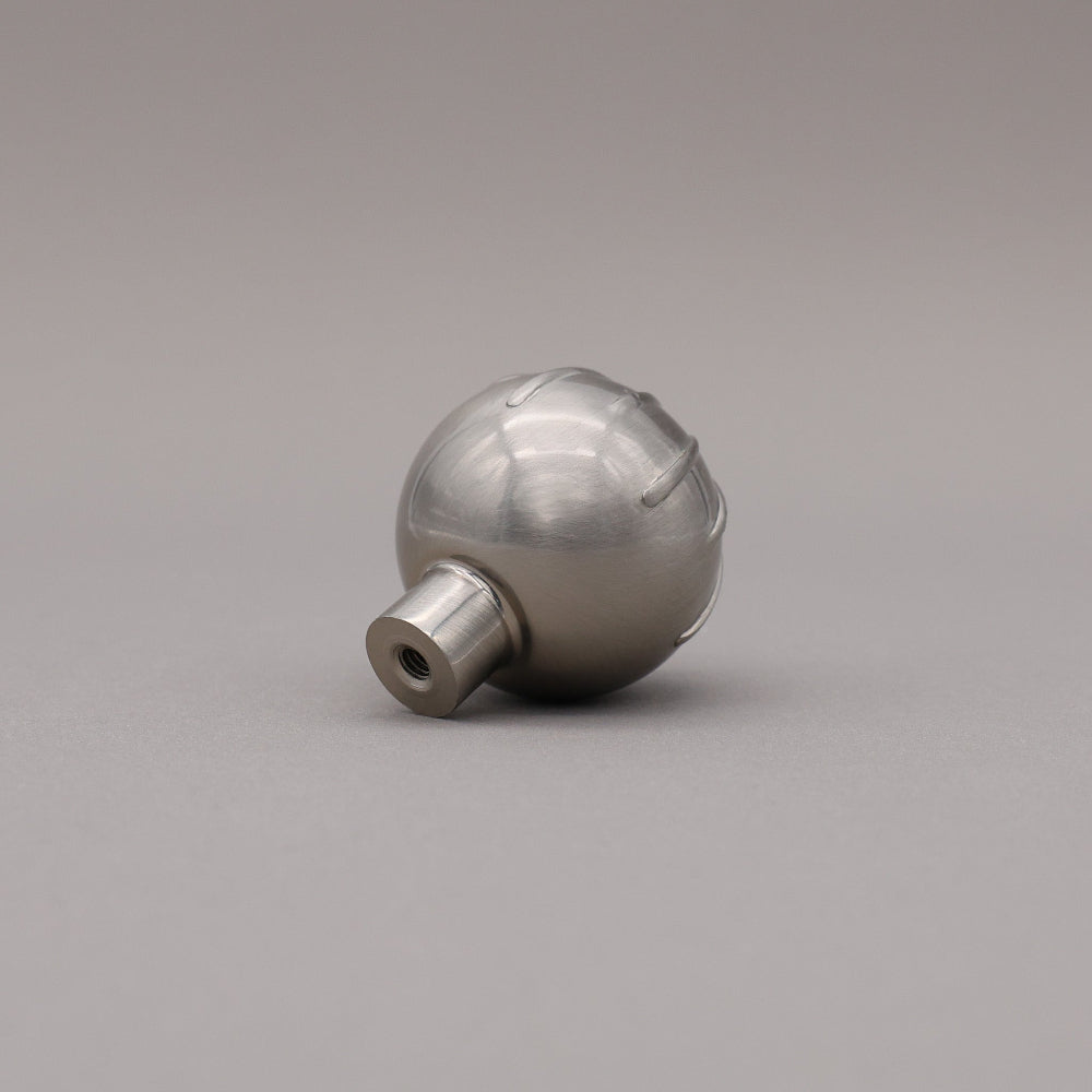 Back view of satin nickel round sunburst knob angled.