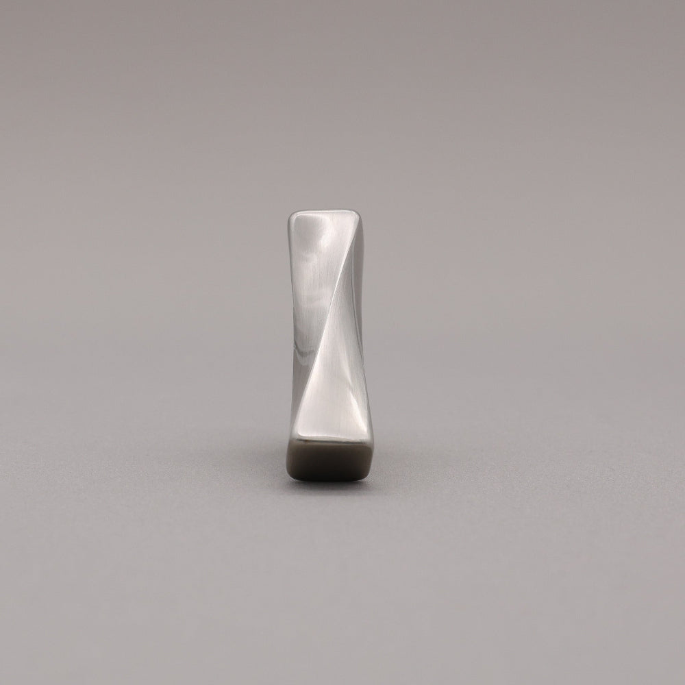 Satin Nickel T-shaped knob on a gray background