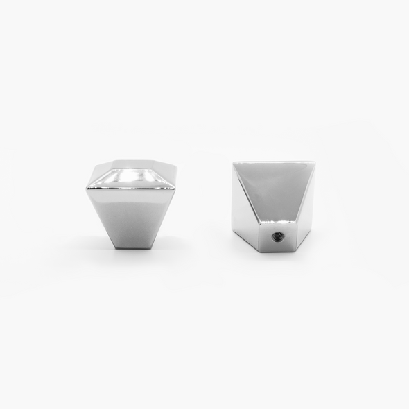 Two Polished Nickel Diamond knobs, one standing and one rear-facing while laying down