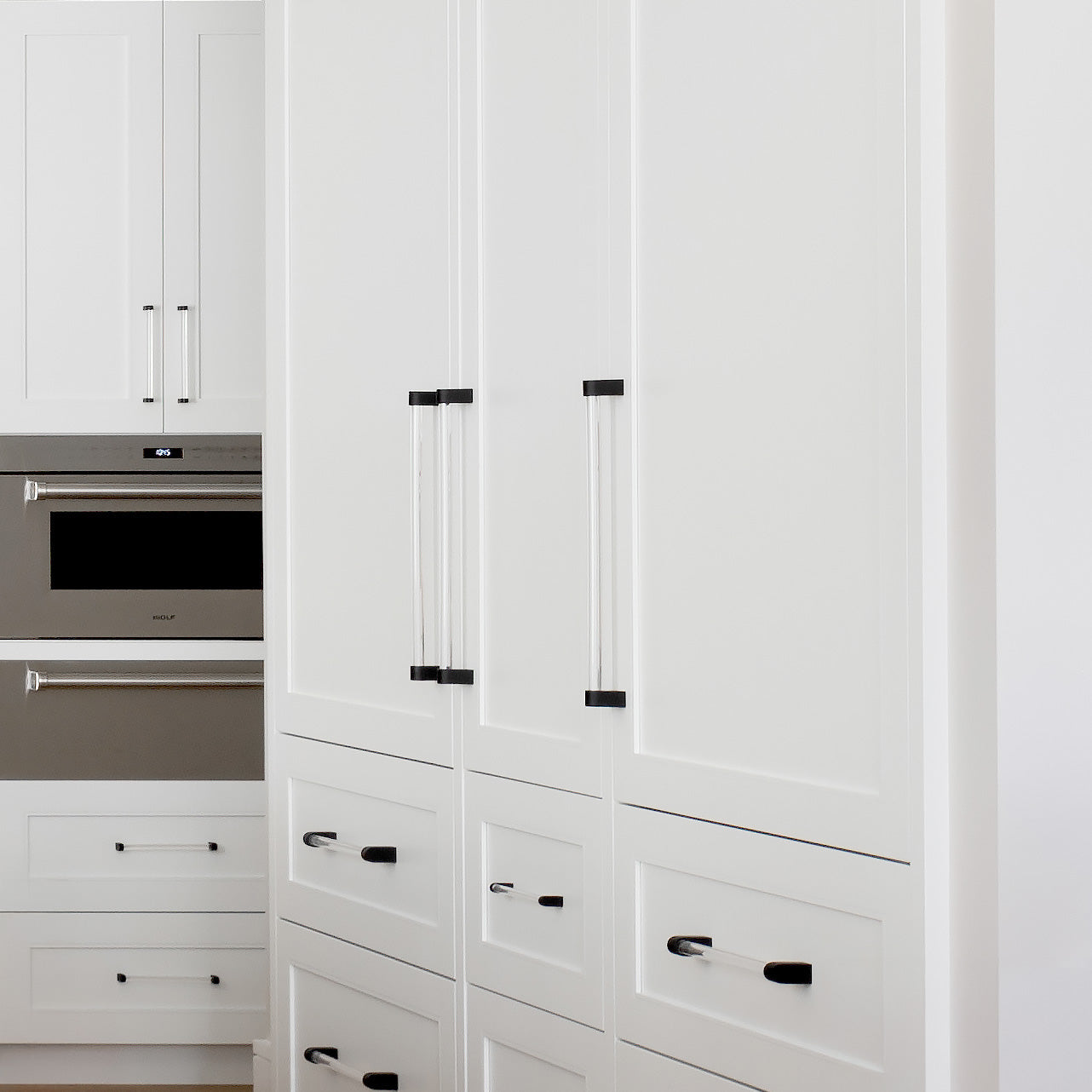 Designer Appliance Pulls in White Kitchen.