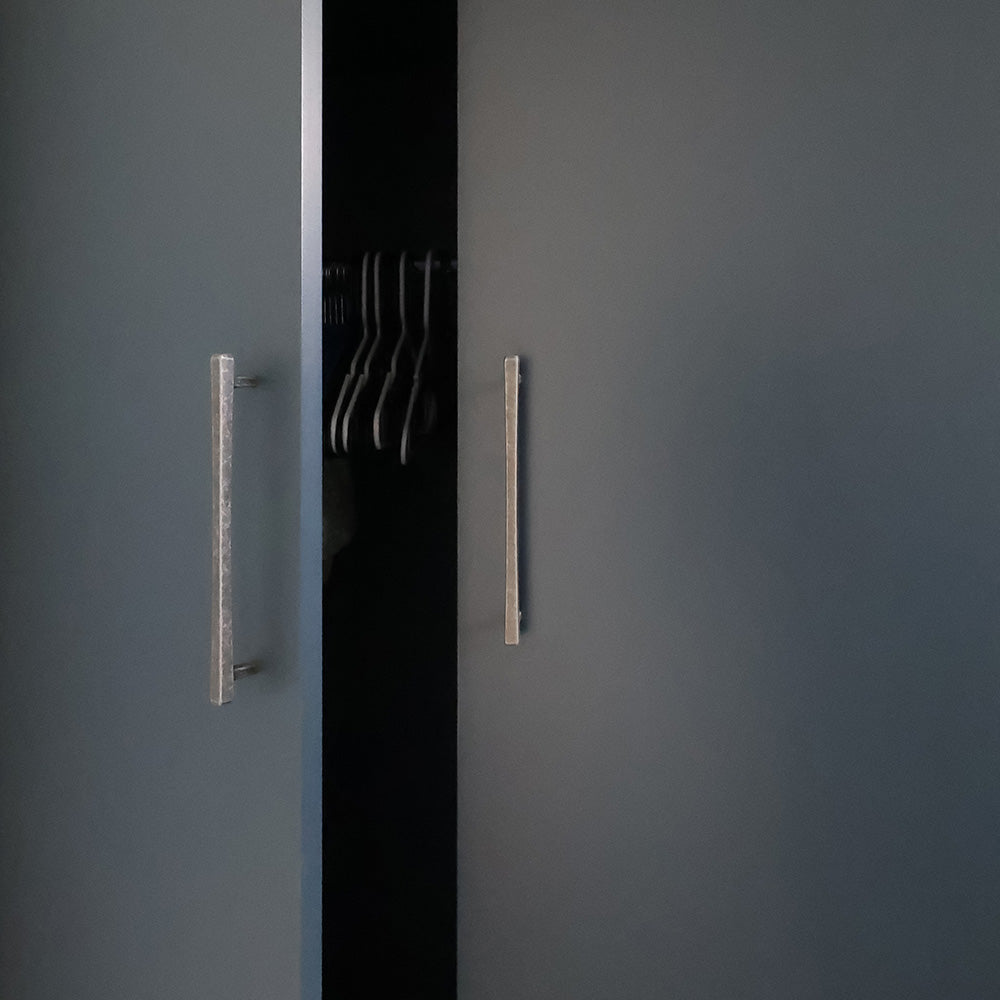 Weather nickel cabinet pulls on closet.