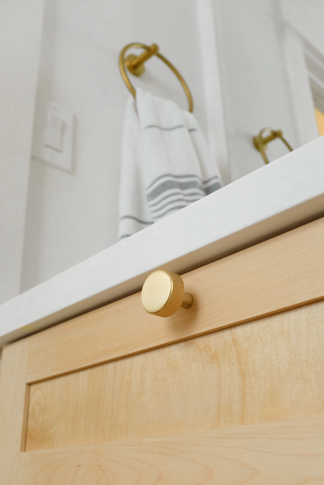 Minimalist Satin Brass Knob on Kitchen Wooden Shaker Drawer.