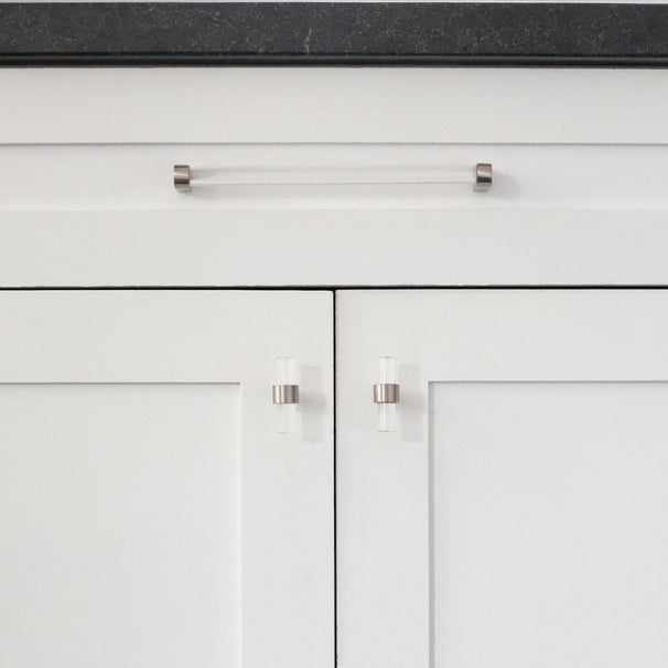 satin nickel clarity acrylic cabinet pull and knobs installed on white cabinet