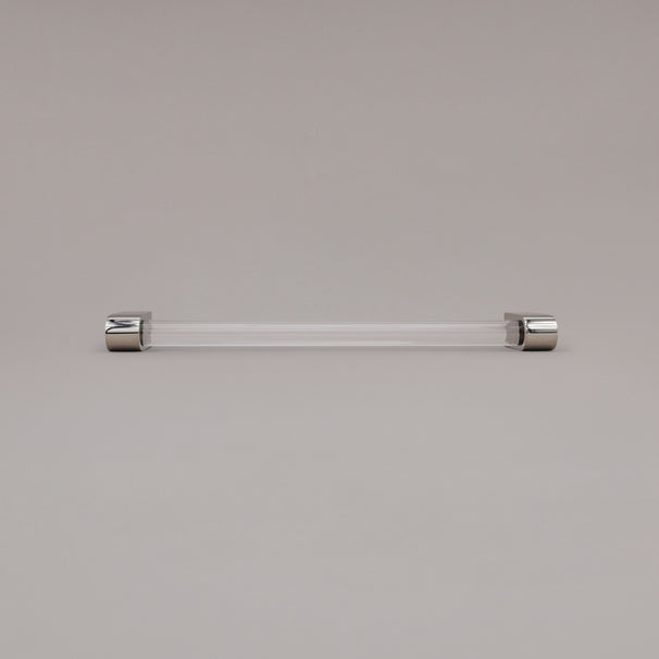 Clarity clear acrylic and polished nickel stems 12 inch appliance pull laying on gray background