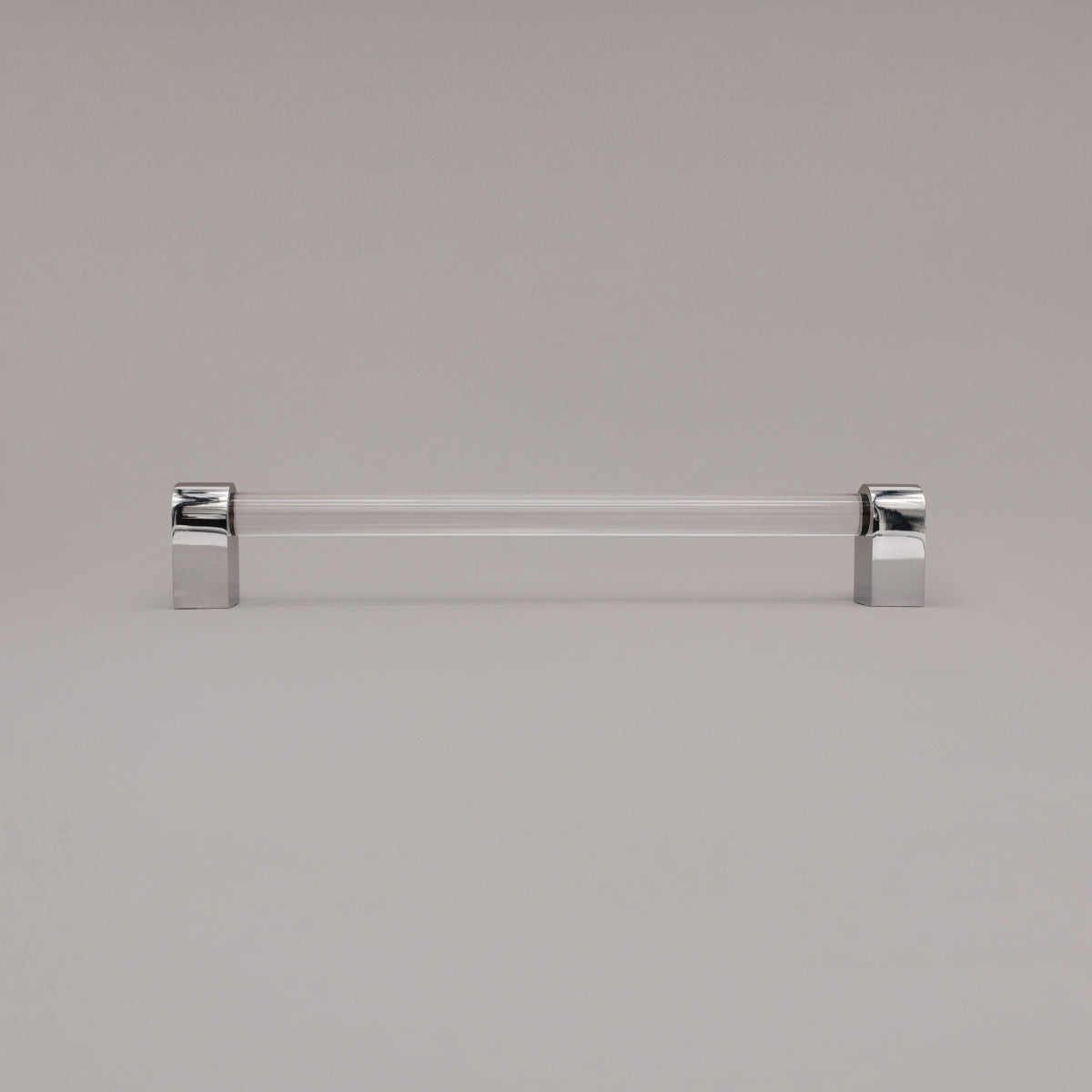 Clarity clear acrylic and polished nickel stems 12 inch appliance pull standing on gray background