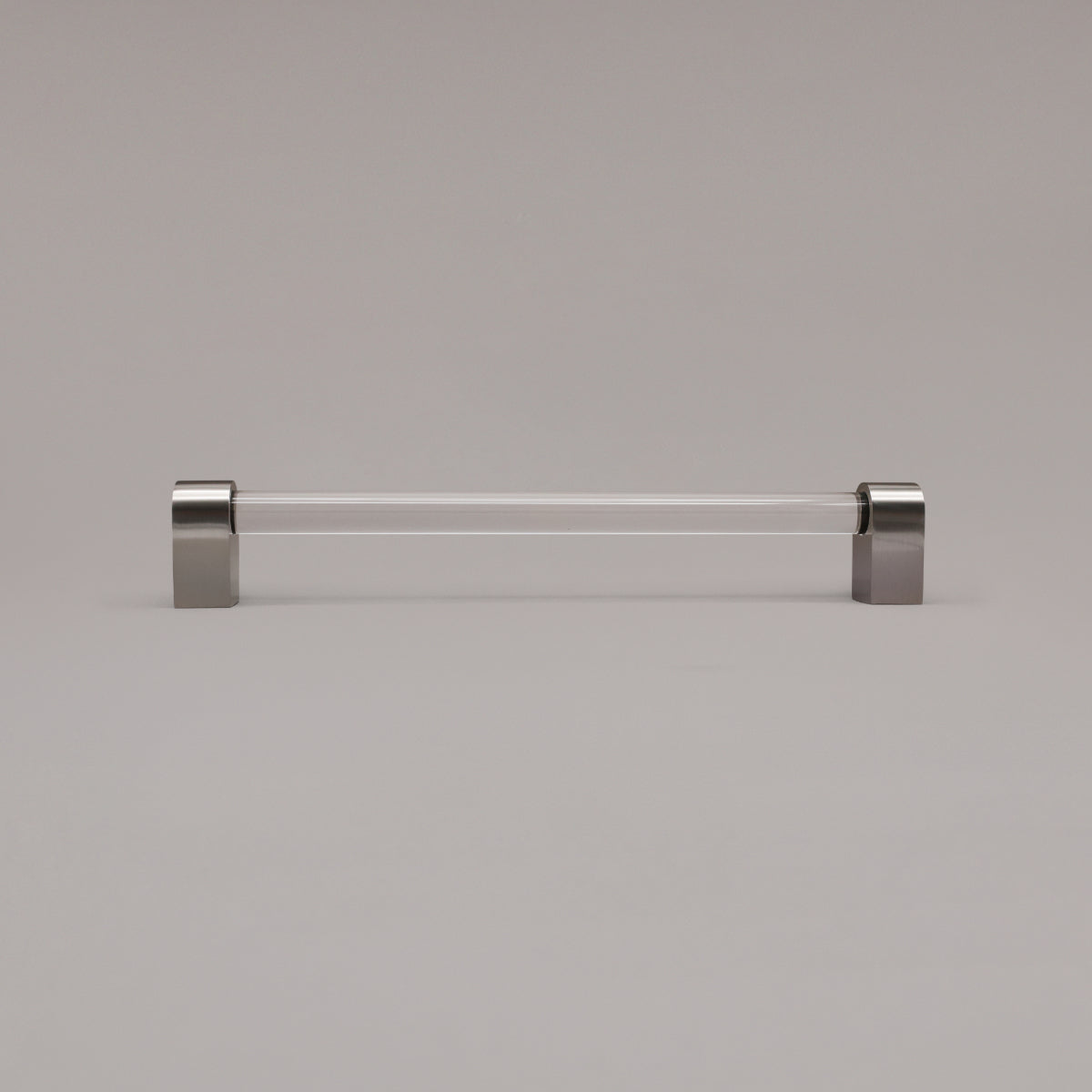 Clarity clear acrylic and satin nickel stems 12 inch appliance pull standing on gray background