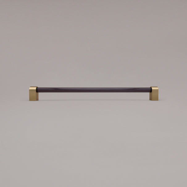 Clarity smoke acrylic and satin brass stems 18 inch appliance pull standing on gray background