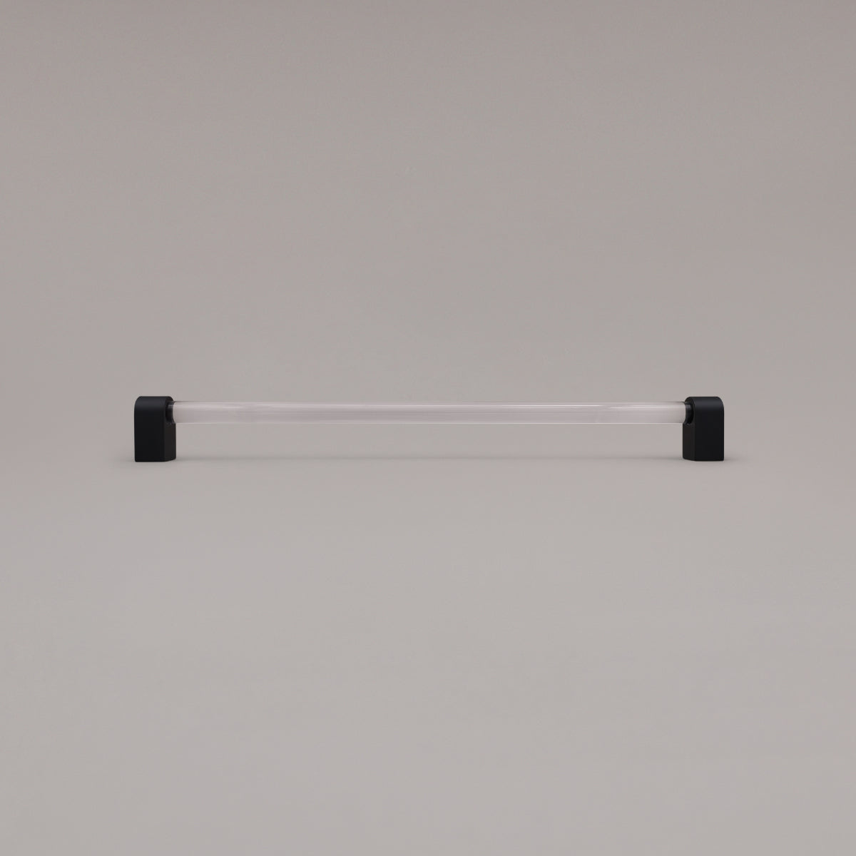 Clarity clear acrylic and matte black stems 18 inch appliance pull standing on gray background