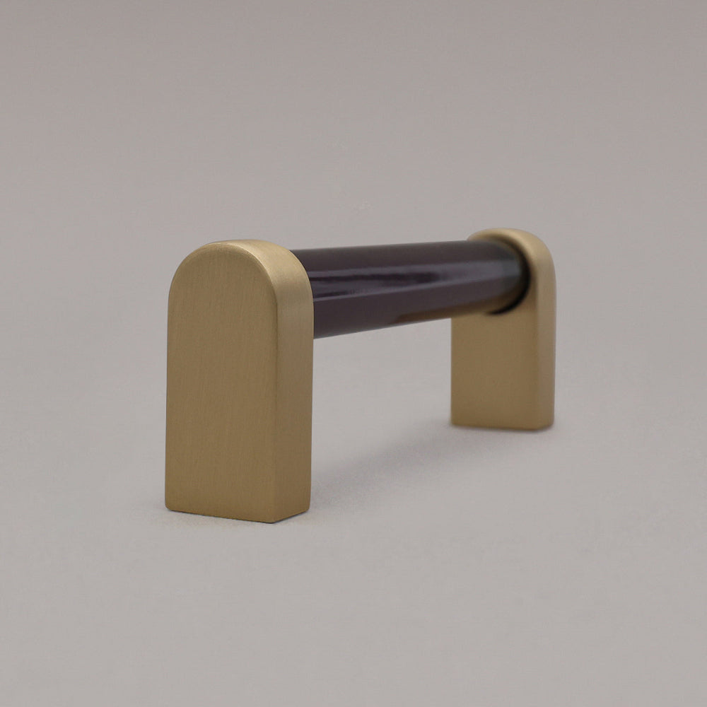 small smoke and satin brass cabinet pull side view on gray background