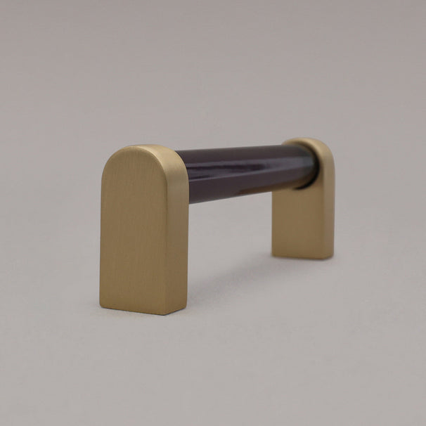 small smoke and satin brass cabinet pull side view on gray background