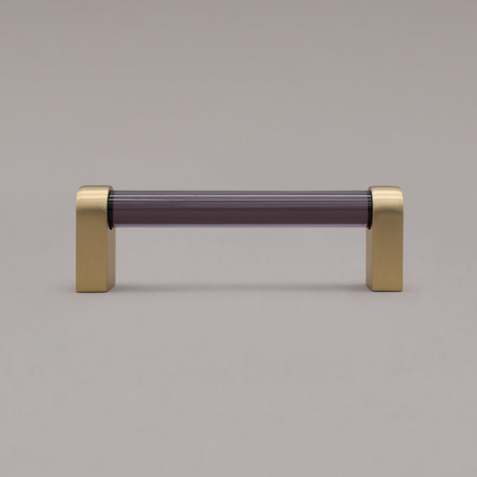 small smoke and matte black cabinet pull standing on gray background