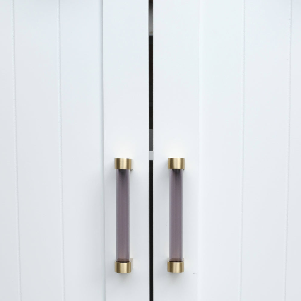 smoke and satin brass cabinet pulls on white cabinet