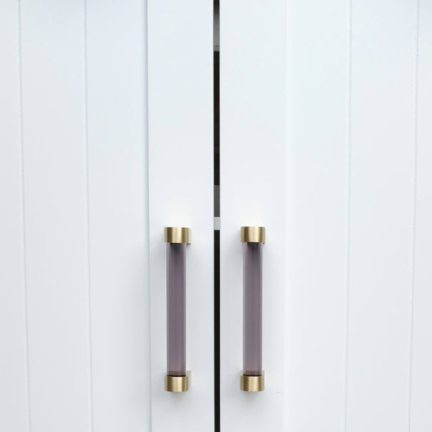smoke and satin brass cabinet pulls on white cabinet