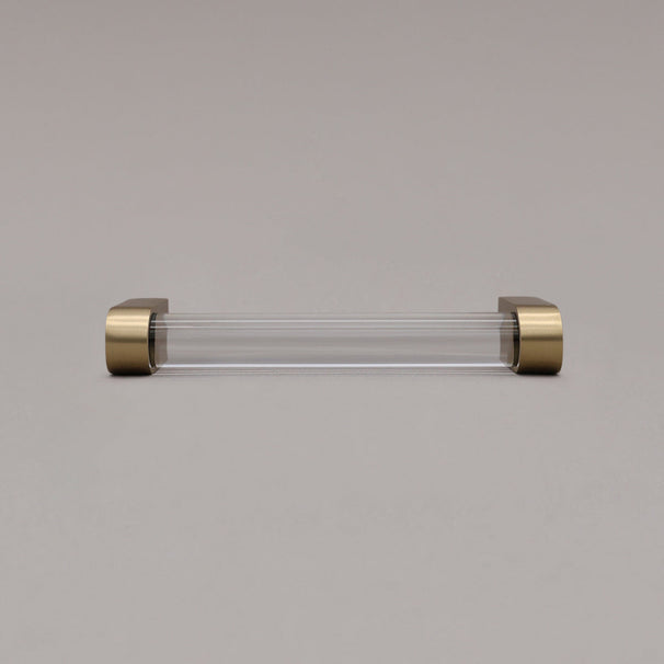 front view of small clarity cabinet pull on gray background