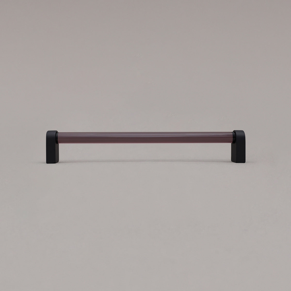 large smoke and matte black cabinet pull standing on gray background