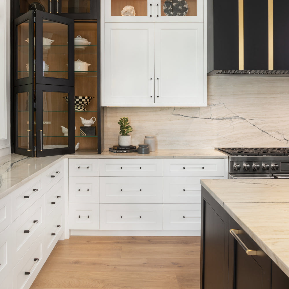 white kitchen cabinets with clear and matte black cabinet pulls