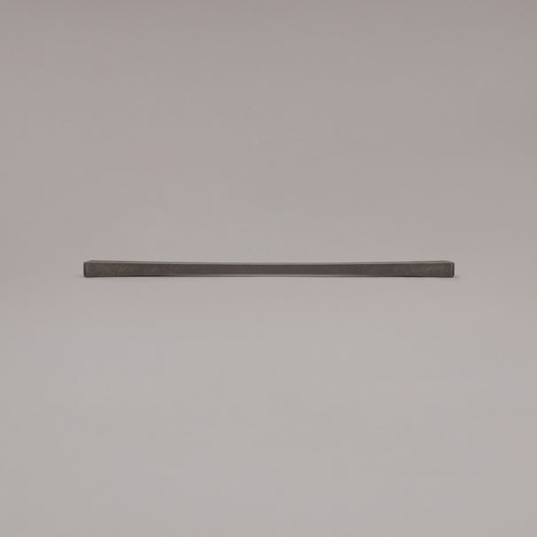 18" Diamond appliance pull in Weathered Nickel laying on gray background