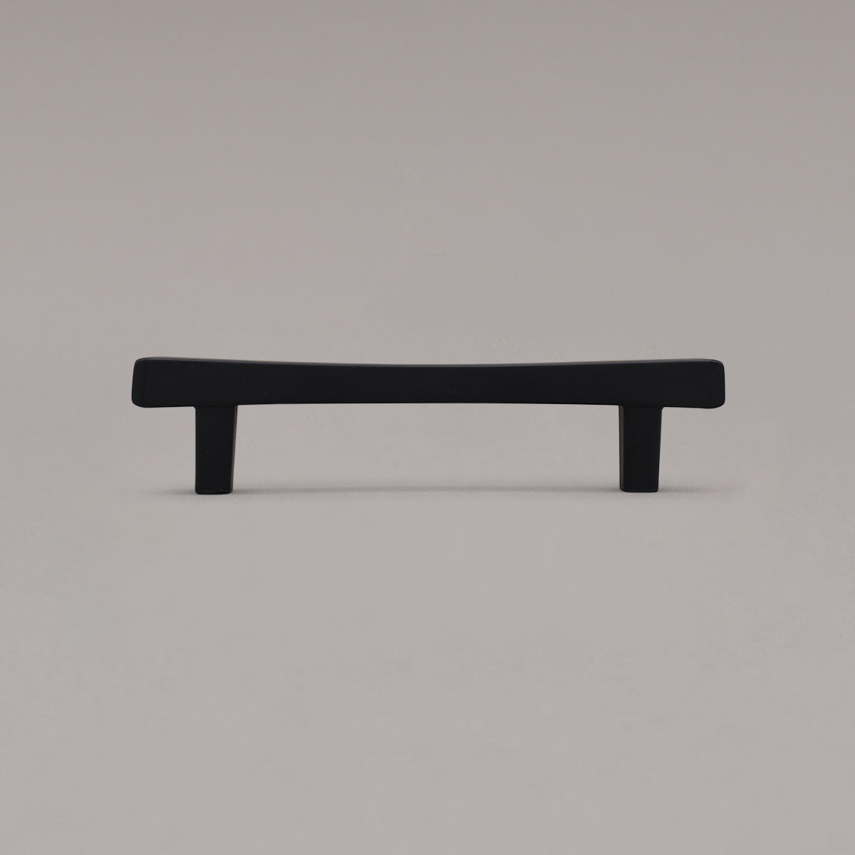 Black diamond cabinet pull standing on gray background