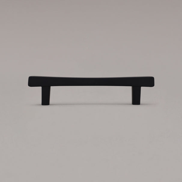 Black diamond cabinet pull standing on gray background