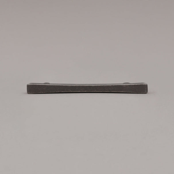 weathered nickel diamond pull laying down on gray background