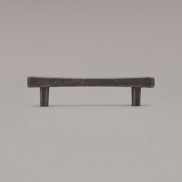 weathered nickel diamond cabinet pull standing on gray background