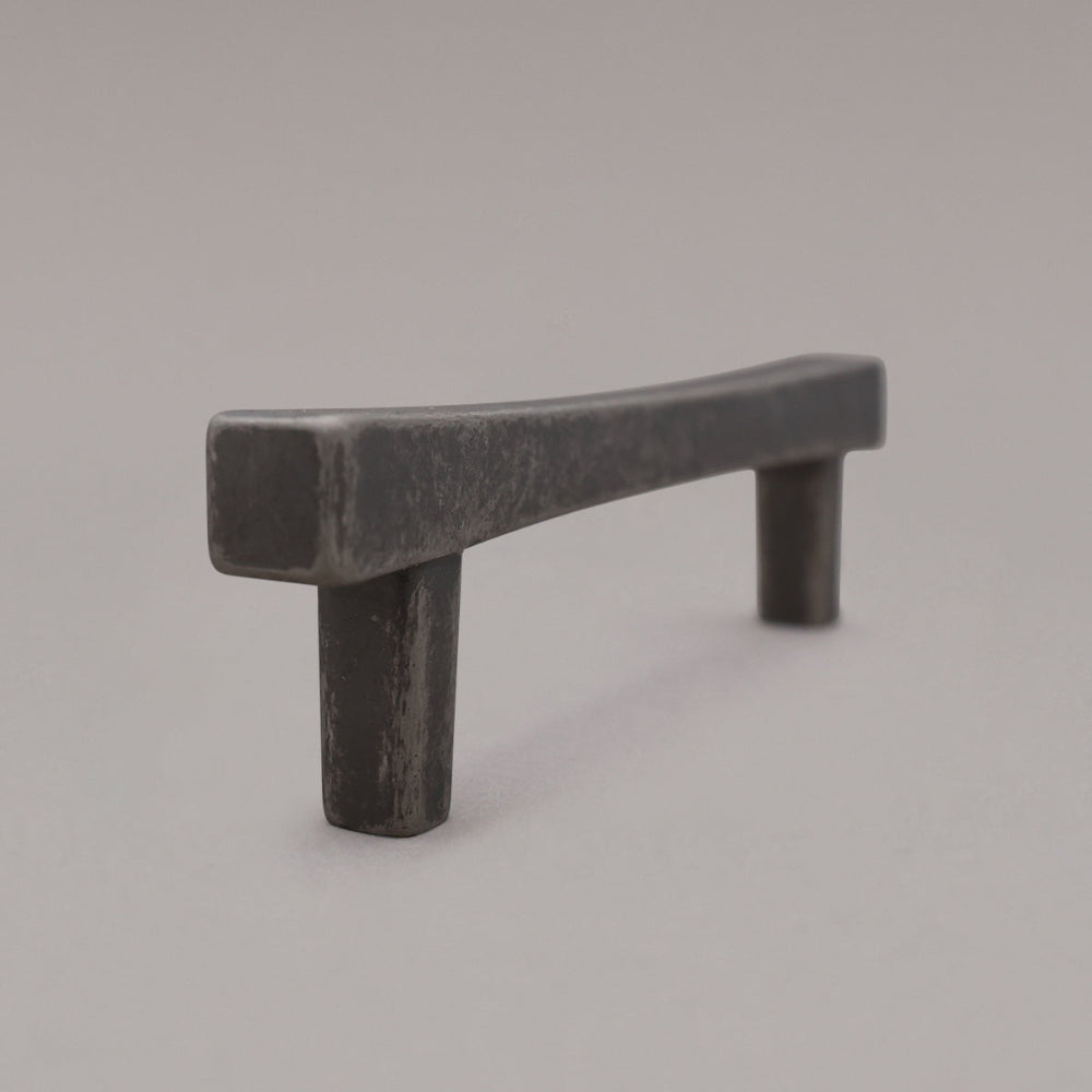 weathered nickel diamond pull standing on gray background, side view