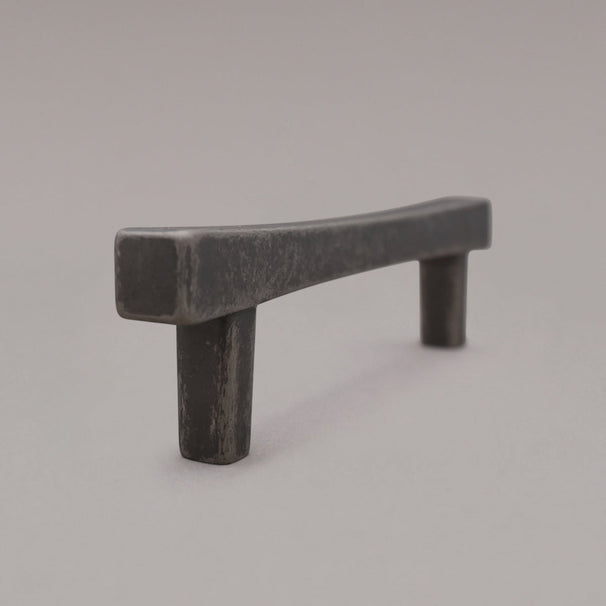 weathered nickel diamond pull standing on gray background, side view