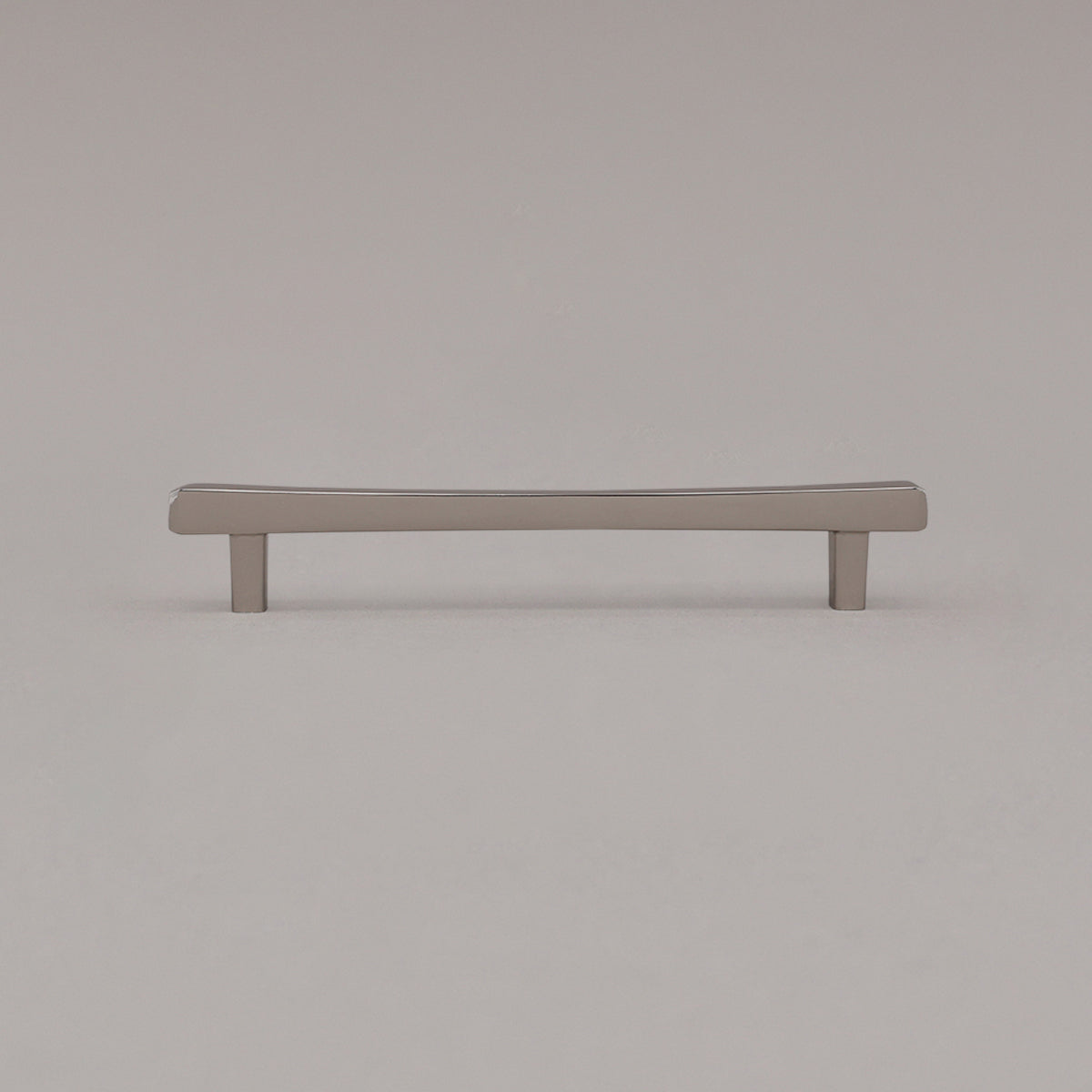 Medium polished nickel diamond cabinet pull standing on gray background