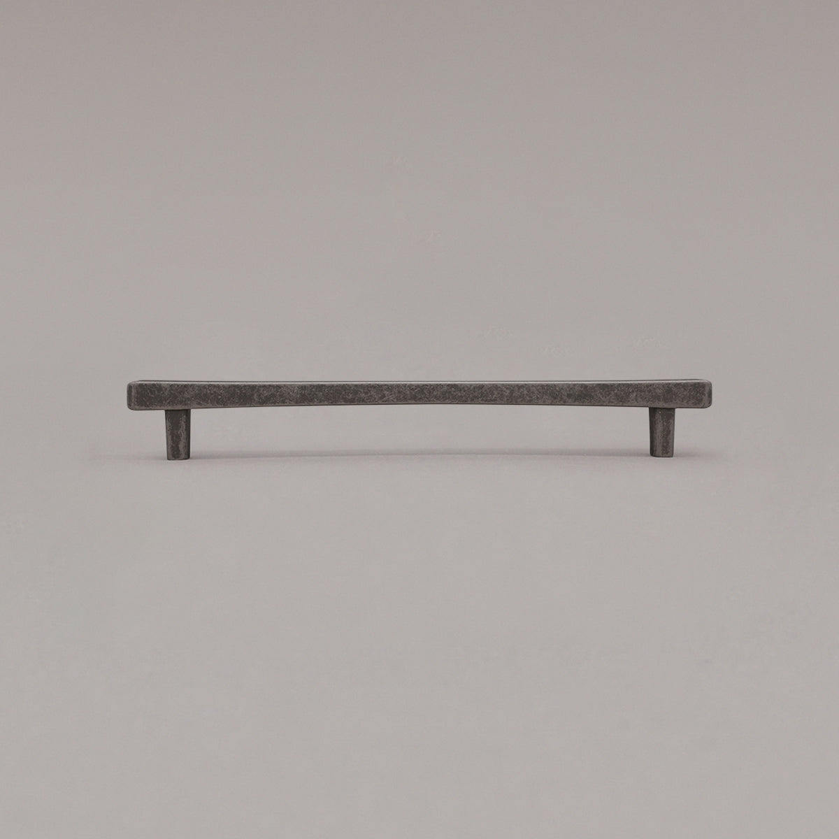 Large weathered nickel diamond cabinet pull standing on gray background