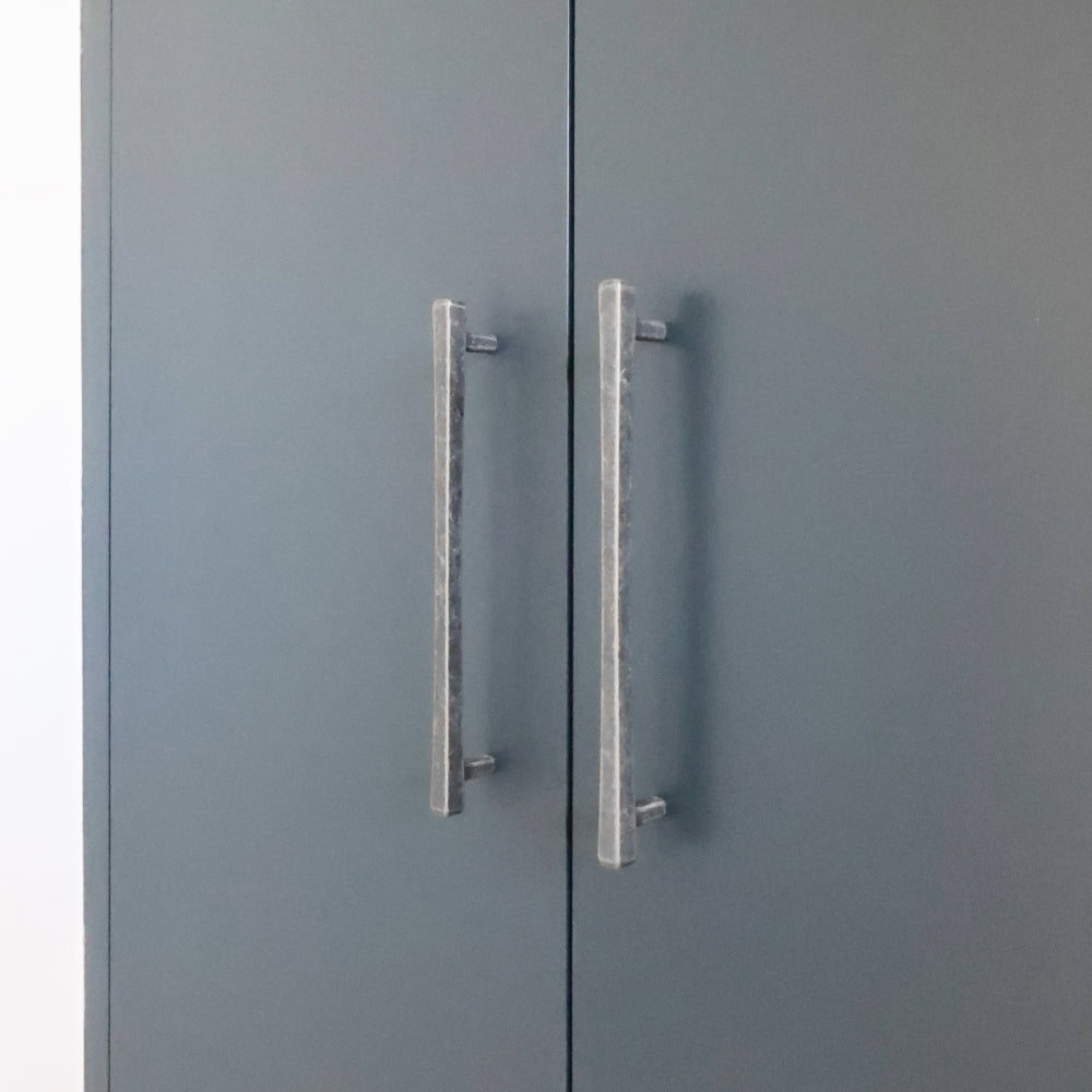 weathered nickel diamond pulls installed on blue cabinet