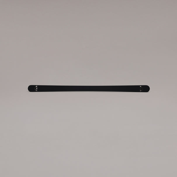 18" Horizon appliance pull in Matte Black laying on gray background