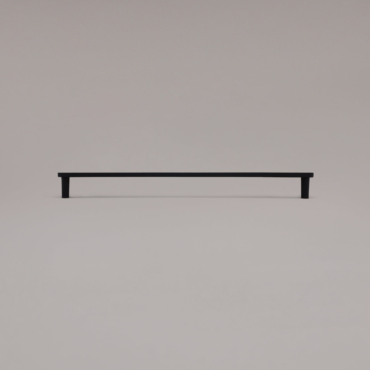 18" Horizon appliance pull in Matte Black standing on gray background