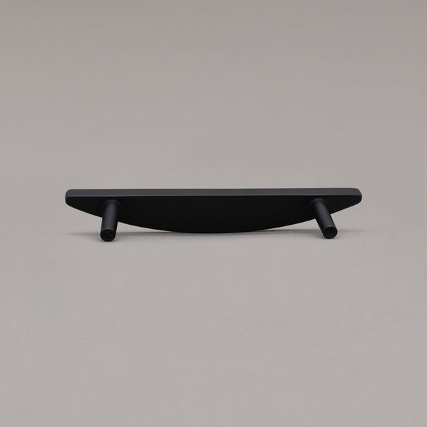 small matte black half moon pull rear view on gray background