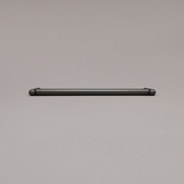 12" Knurled appliance pull in Graphite laying on gray background