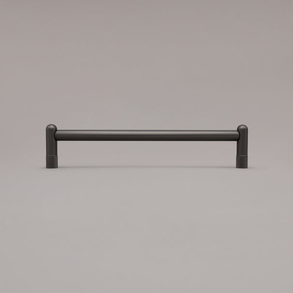 12" knurled appliance pull in graphite standing on gray background