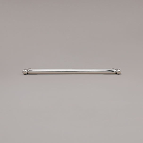 12" Knurled appliance pull in Polished Nickel laying on gray background