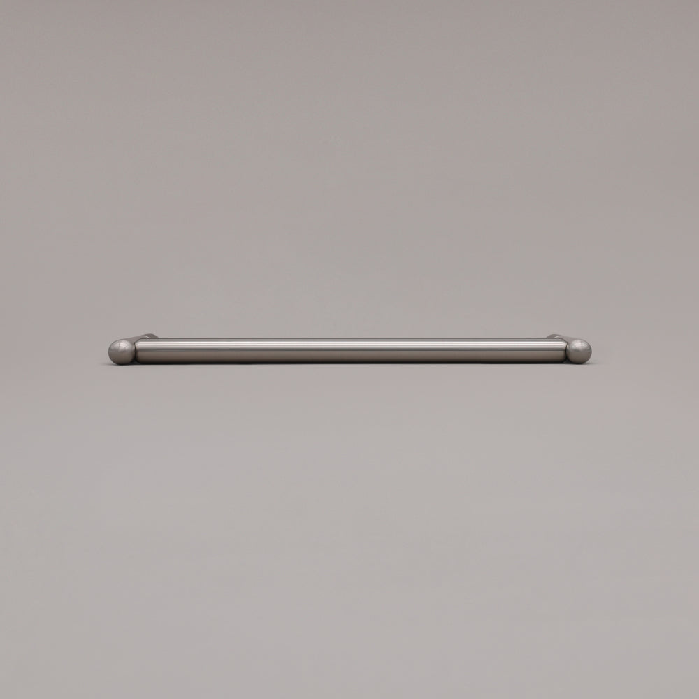 12" Knurled appliance pull in Satin Nickel laying on gray background