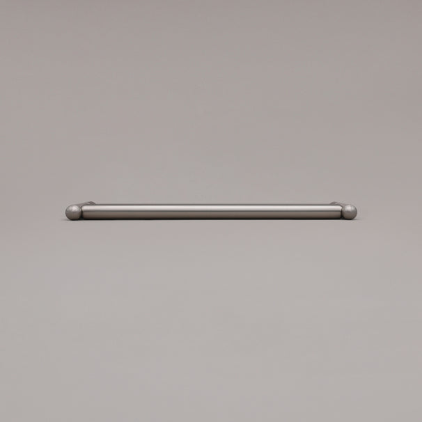 12" Knurled appliance pull in Satin Nickel laying on gray background