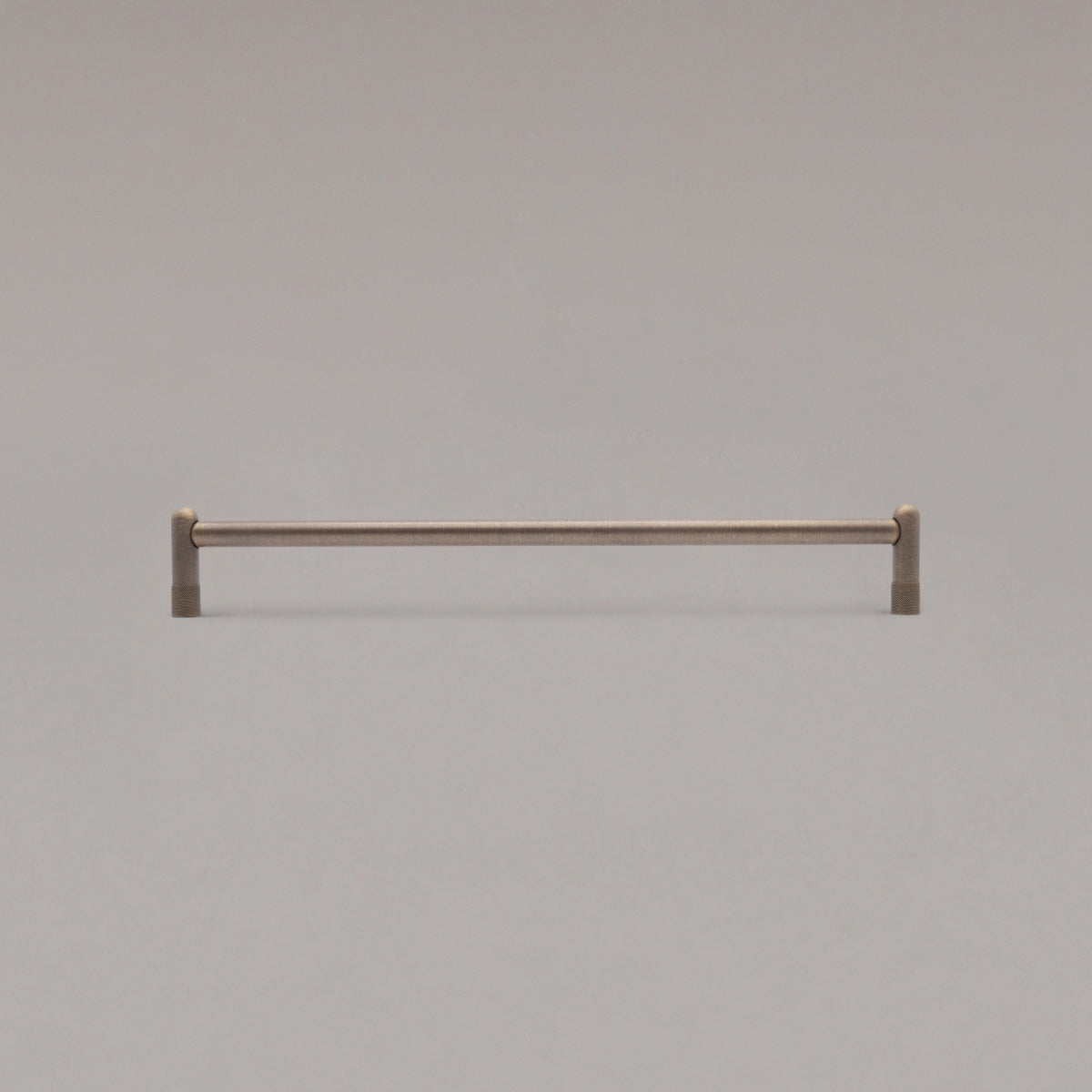 18" knurled appliance pull in antique english standing on gray background