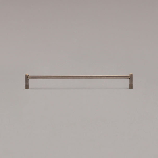 18" knurled appliance pull in antique english standing on gray background