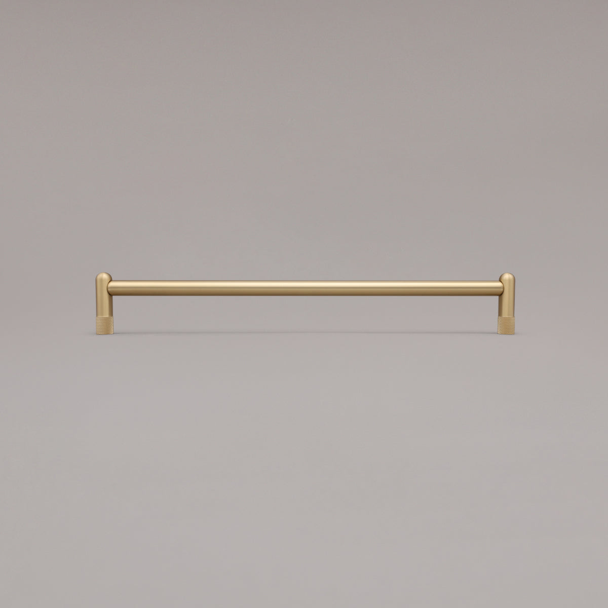 18" knurled appliance pull in satin brass standing on gray background